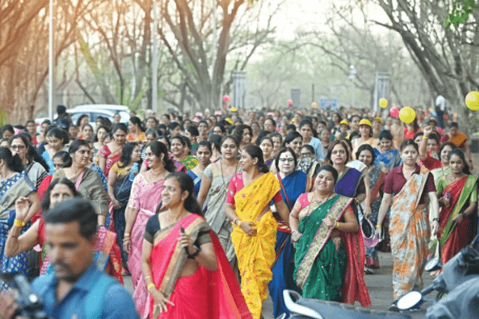 Women in sarees running together